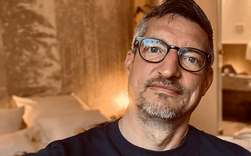 Peace Not Posture: Gregg The Artivist sitting in his hotel room