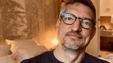 Peace Not Posture: Gregg The Artivist sitting in his hotel room